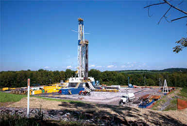 A fracking rig and operation stands among forests and fields in Bradford County, Pa.