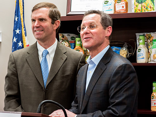 In February, Gov. Andy Beshear, left, joined Dave Ciesinski, president and CEO of Lancaster Colony, and other leaders from T. Marzetti to announce the company's 140-job expansion in Horse Cave.