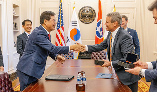 Tennessee Gov. Bill Lee shakes hands with Hak Cheol Shin, CEO of LG Chem, before the official project announcement at the Tennessee State Capitol in Nashville on November 21, 2022. 