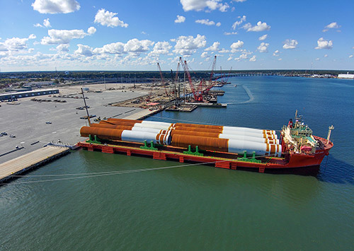 The first eight monopile foundations for the Coastal Virginia Offshore Wind commercial project arrived at Portsmouth Marine Terminal in October 2023. The project will provide 8.8 million megawatts of power when complete, enough to power up to 660,000 homes.